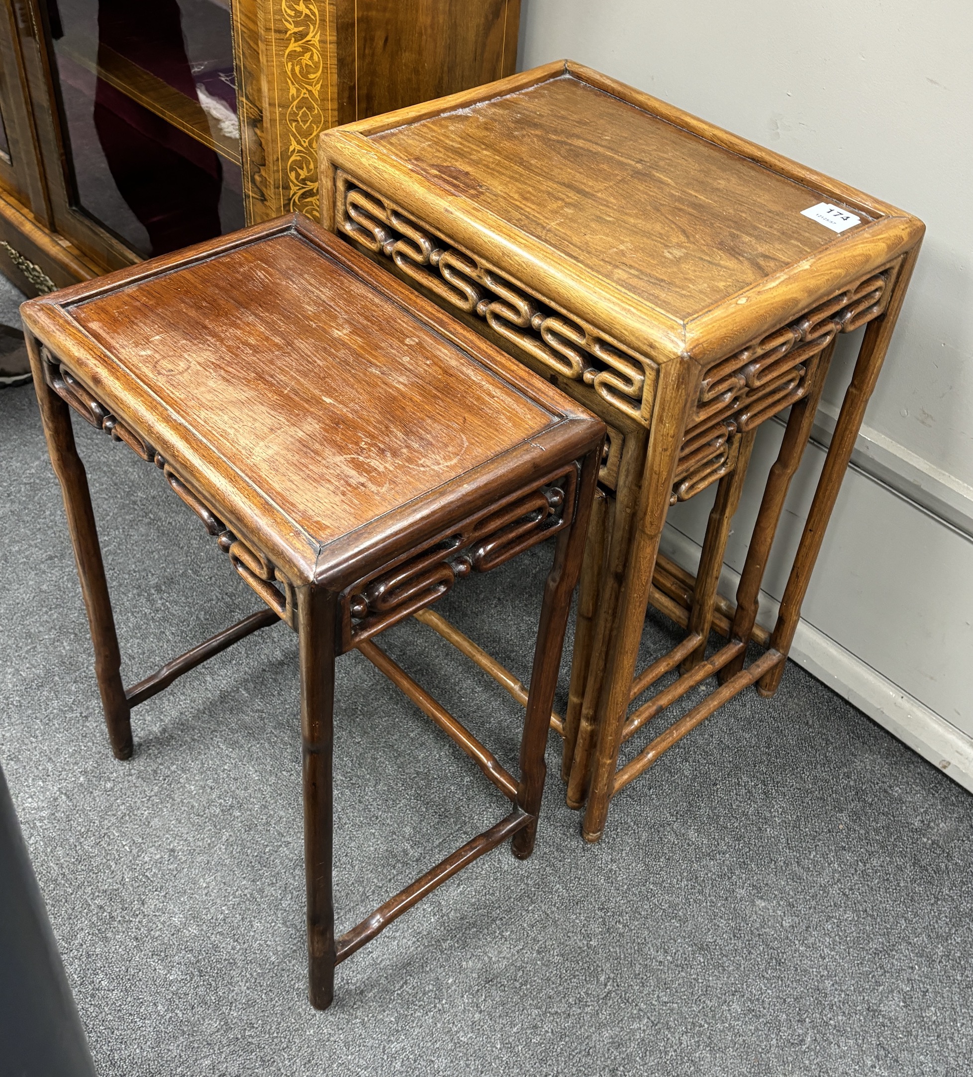 A nest of three Chinese tea tables, width 44cm, depth 32cm, height 62cm, and one other